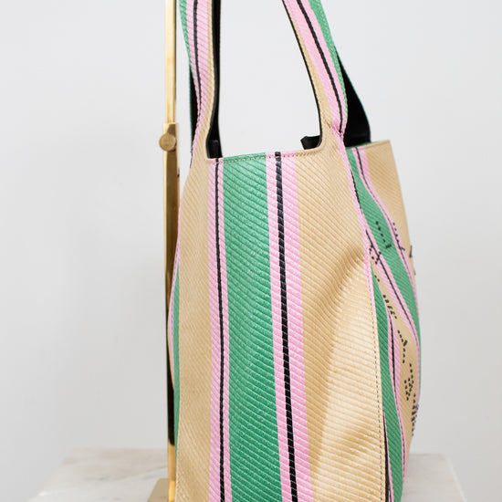 Beige tote bag with green and pink stripes on a white background