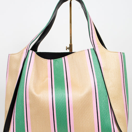 Striped handbag with green, pink, and beige colors on a white background