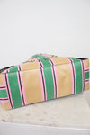 Striped bag with pink and green pattern on a white background