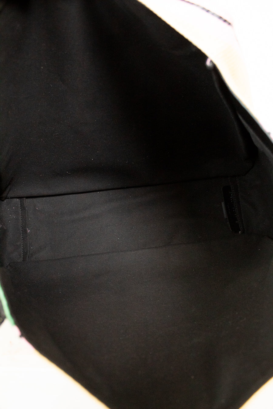 Close-up of a black interior of bag on a white background