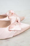 Close-up of satin bow on shoes
