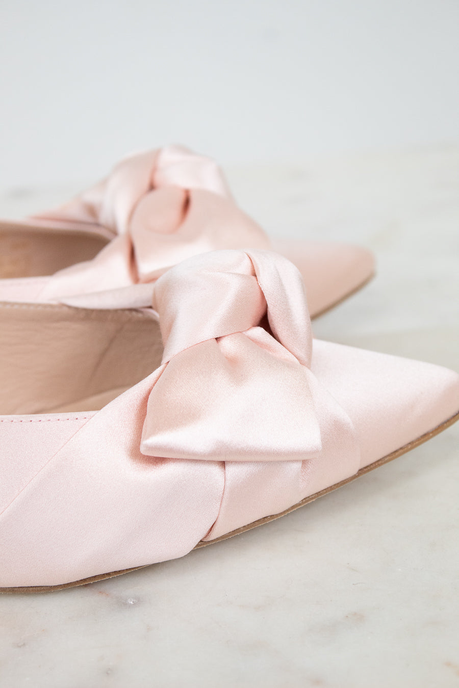 Close-up of satin bow on shoes