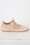 Beige sneaker with floral lace design on a light background