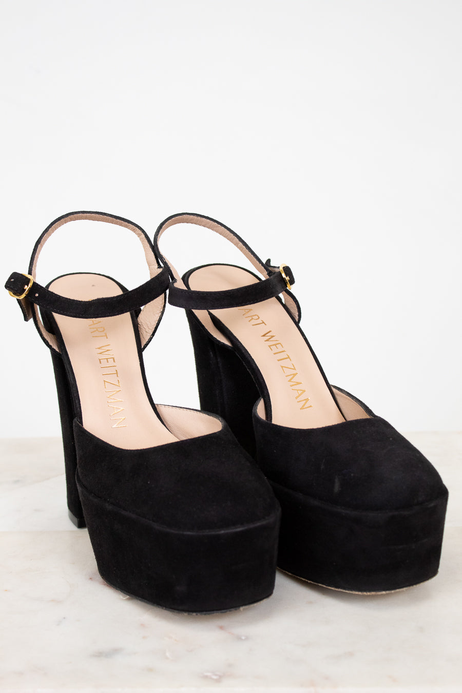 Black platform sandals on a white background