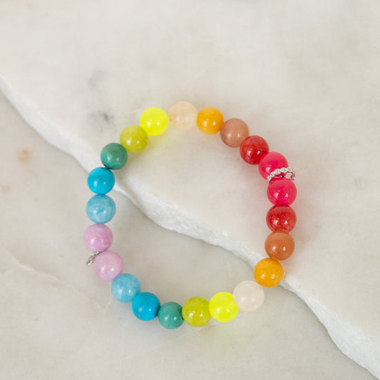 Colorful beaded bracelet on a marble surface