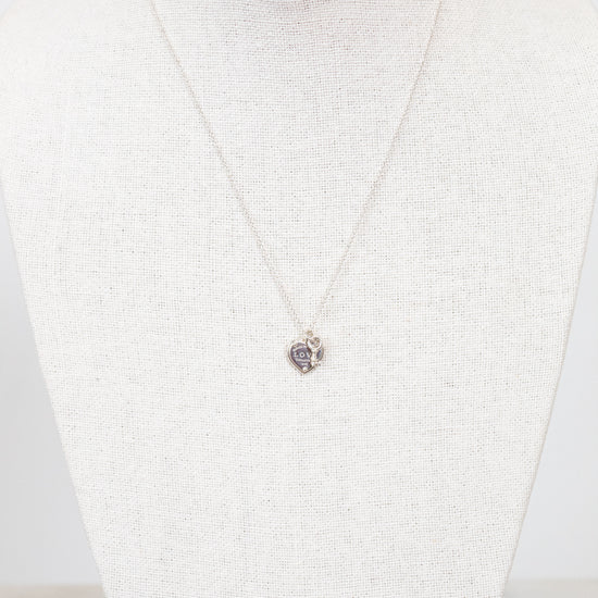 Necklace with a pendant on a mannequin against a white background