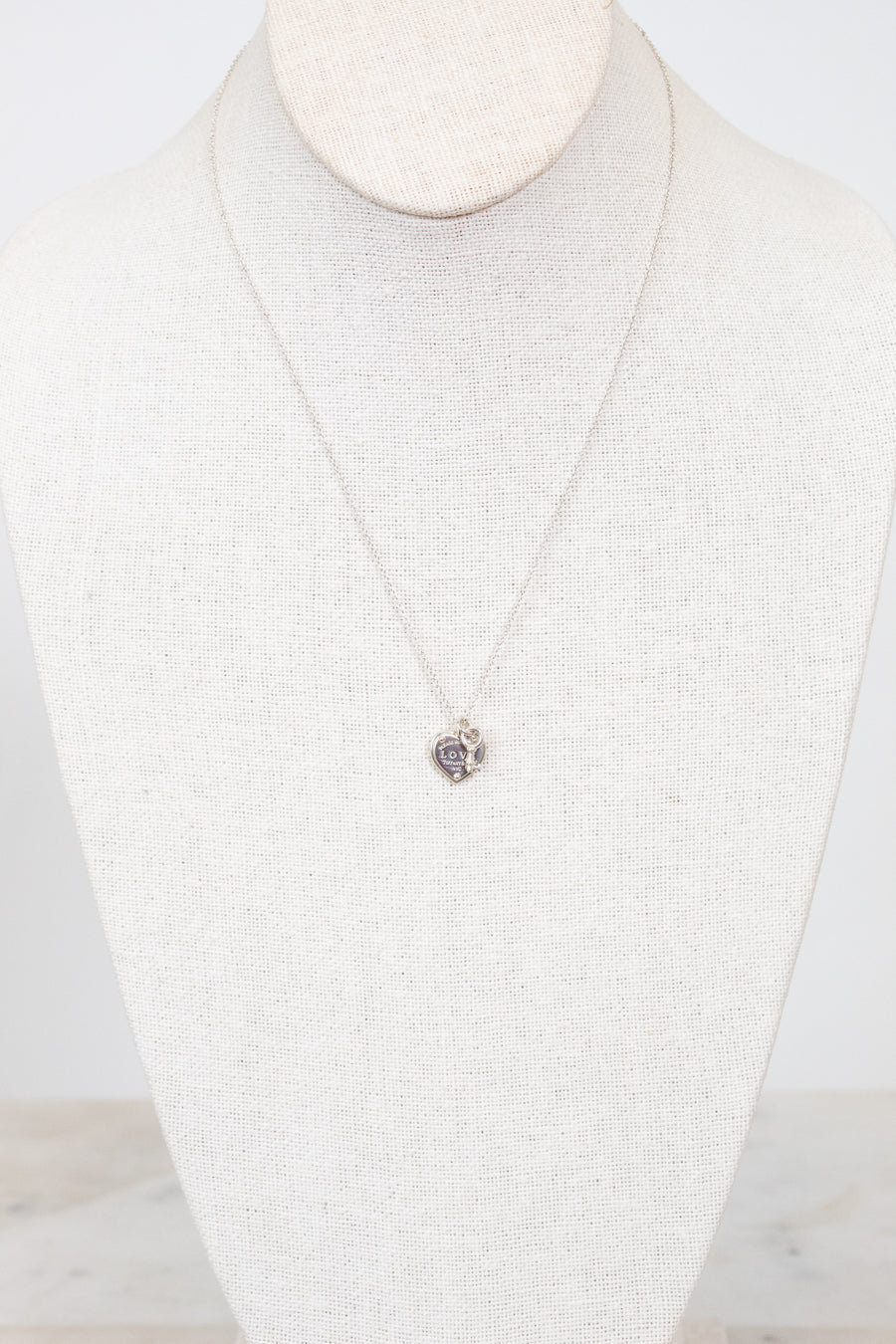 Necklace with a pendant on a mannequin against a white background