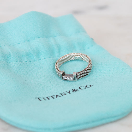Silver ring on a Tiffany & Co blue pillow