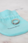 Silver ring on a Tiffany & Co blue pillow
