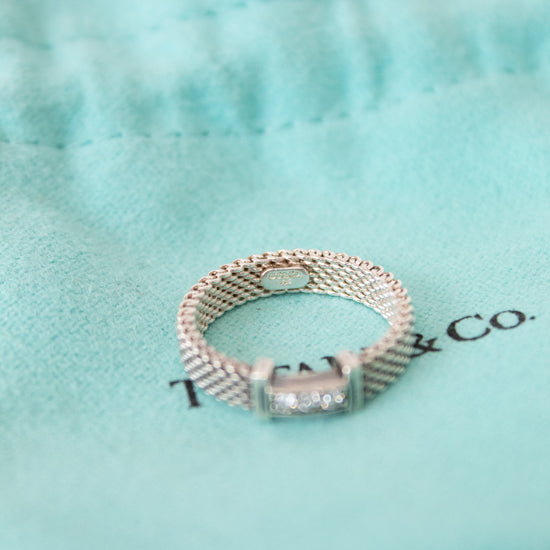 Silver ring with a diamond on a Tiffany & Co. box