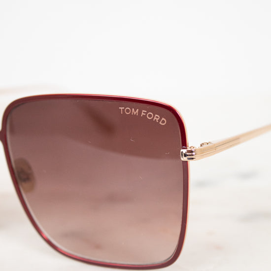 Tom Ford sunglasses with a brown gradient lens on a white background