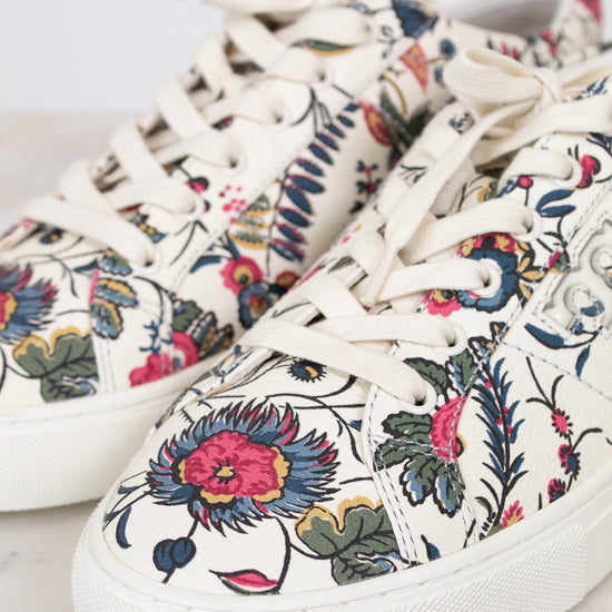 Floral patterned sneakers on a light background