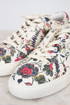 Floral patterned sneakers on a light background