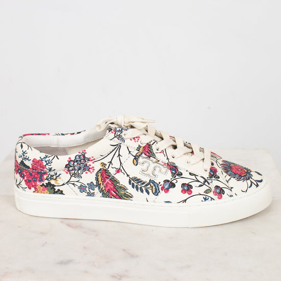 Floral-patterned sneaker on a white marble surface