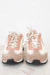 Pair of beige and pink high-top sneakers on a light background