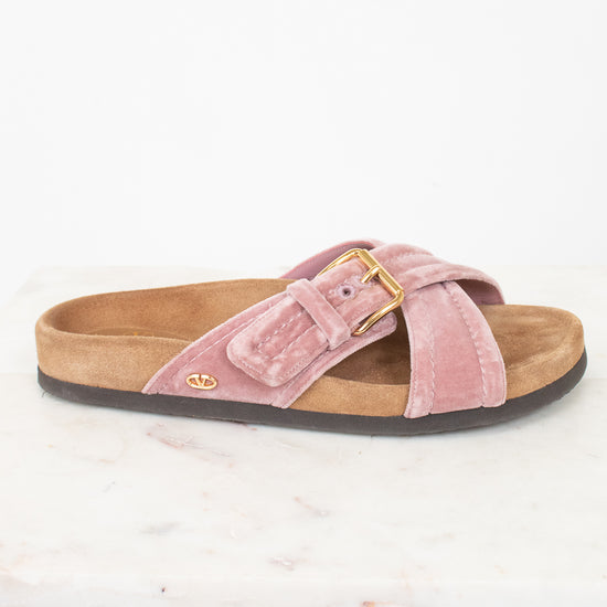 Side view of pink velvet with brown sole sandals