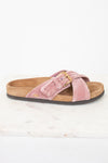 Side view of pink velvet with brown sole sandals