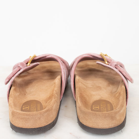 Back view of pink velvet sandal with  brown sole 