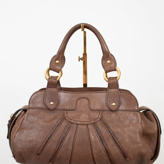 Brown handbag on a white background