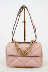 Pink quilted handbag with gold chain detail on a white background