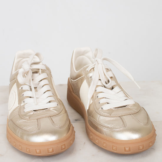Gold and cream lace-up sneakers