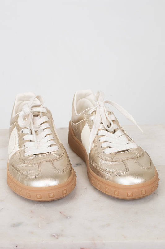 Gold and cream lace-up sneakers