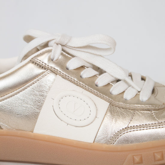 Close-up of cream Valentino logo