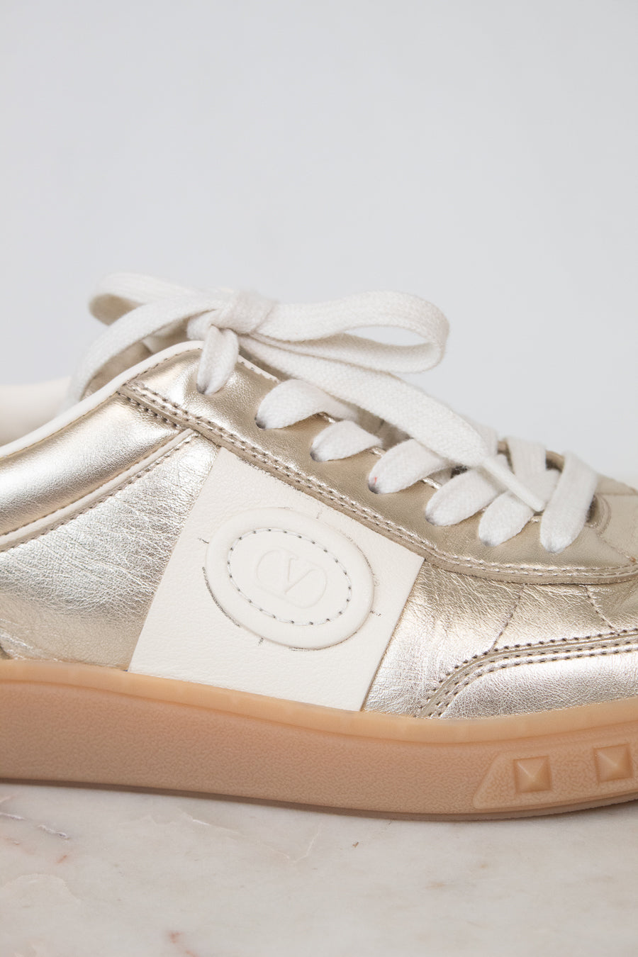 Close-up of cream Valentino logo