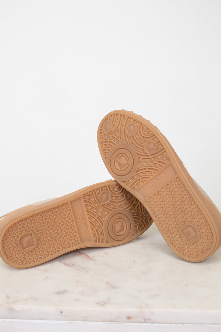 Bottoms of gum sole sneakers