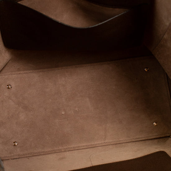 Close-up of a brown leather bag with stitching details