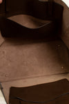 Close-up of a brown leather bag with stitching details