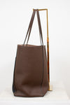 Brown tote bag with black accents on a white background