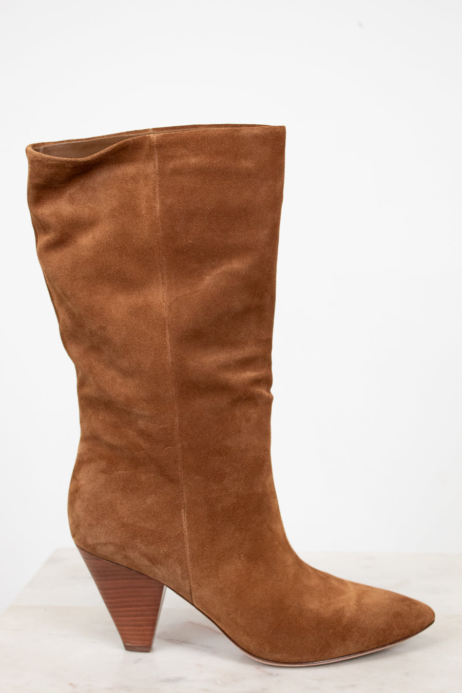 Brown knee-high boot on a white background