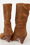 Pair of brown suede knee-high boots on a white background