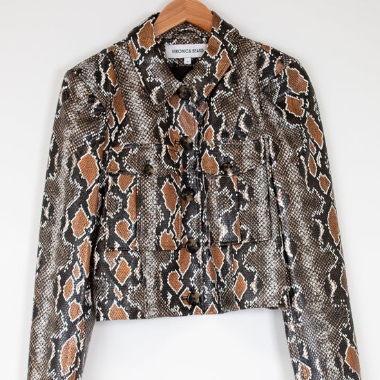Snake print jacket on a hanger against a white background