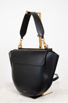 Black handbag with gold accents on a white background