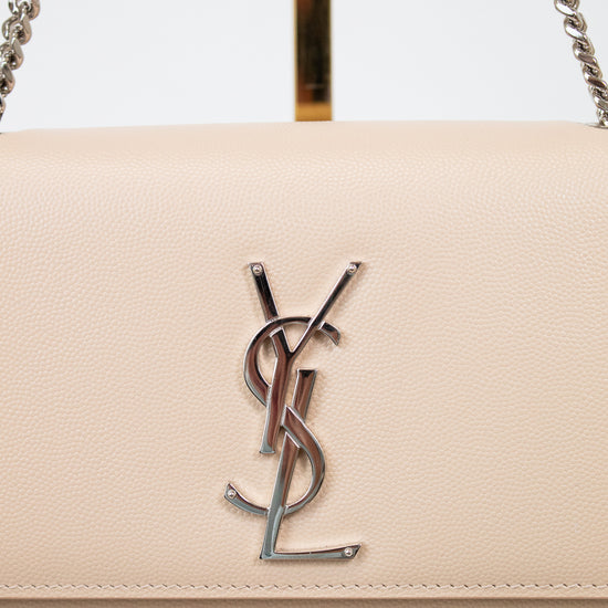 Beige handbag with a prominent logo on a white background