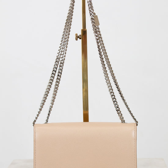 Beige handbag with a chain strap on a white background