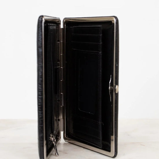 Black wallet with open design on a white background