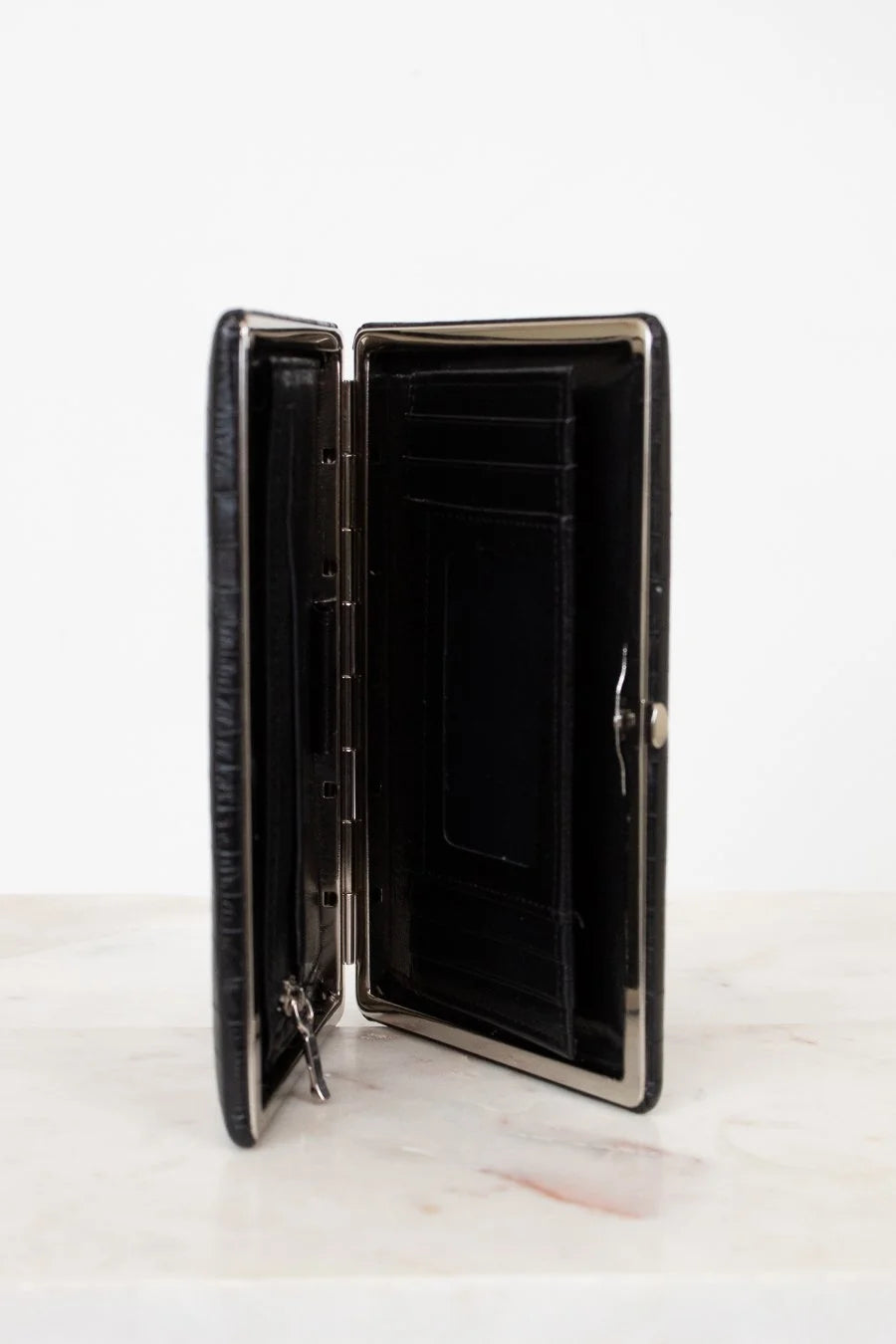 Black wallet with open design on a white background
