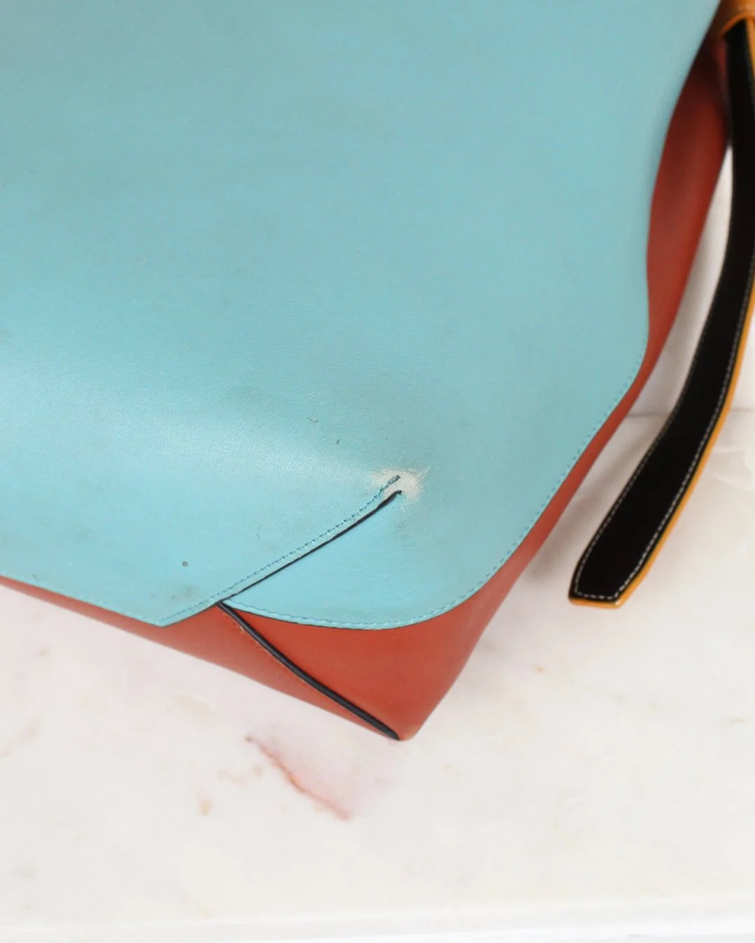 Close-up of a shoe sole with a small white object on a blue and white background