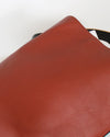 Close-up of a brown leather surface with a white background