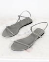 Pair of gray sandals on a white background