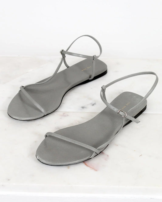 Pair of gray sandals on a white background