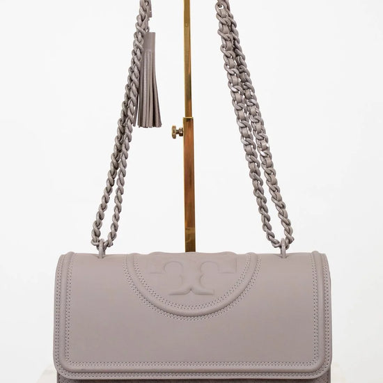 Gray handbag with chain strap on a white background