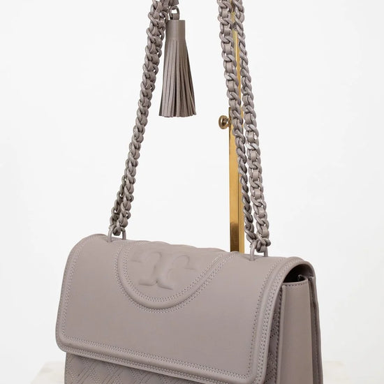 Gray handbag with chain strap on a white background