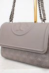 Gray handbag with a chain strap on a white background