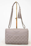 Quilted gray handbag with a chain strap on a white background