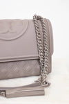 Gray quilted handbag with a chain strap on a white background