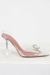 Clear high-heeled shoe with pink insole on a white background